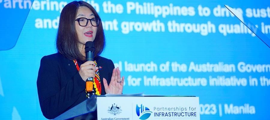 Australia Ambassador to the Philippines stands and gives opening remarks on the stage